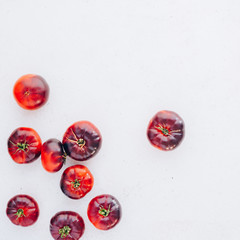 Tomatoes Mar Azul on white wooden table background