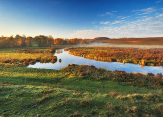 picturesque autumn dawn. valley of the picturesque river. autumn morning