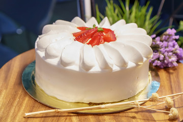 Cake on the wood background.