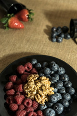 Red fruits with cereals and nuts