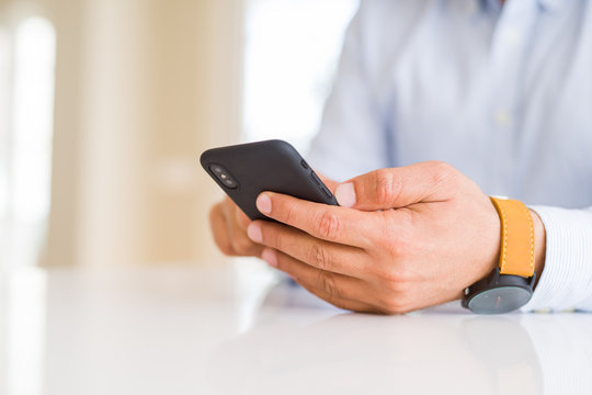 Close up of business man hands using smarpthone