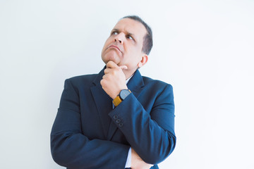 Middle age man thinking clueless about a question