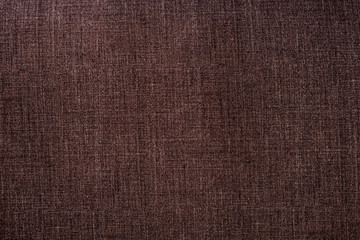 Fototapeta na wymiar Colored textile background texture. Brown seamless pattern