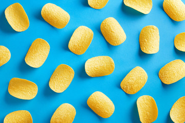 Potato chips pattern on a blue background. Top view