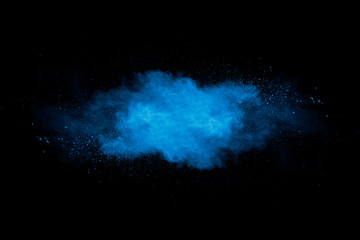 Abstract art blue powder on black background. - 250081644