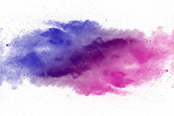 Obraz premium Explosion of multicolored dust on white background.