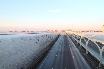 city highway in the winter at sunset