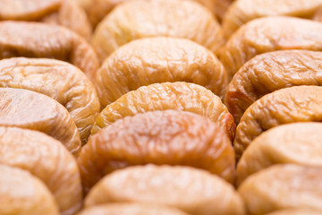Dried figs closeup. Dried figs laid out in rows.