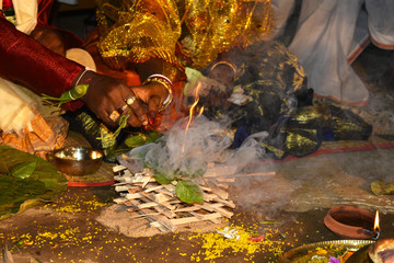 A Indian marriage ceremony.The bride and groom promise together with the sacred fire