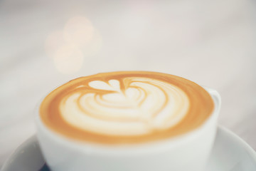Top view of hot coffee latte with latte art