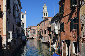 Fototapeta na wymiar Canal and historical buildings in Venice, Italy