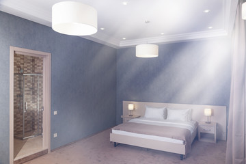 The double bed in the hotel room has a stylish interior. Lamps with lampshades.