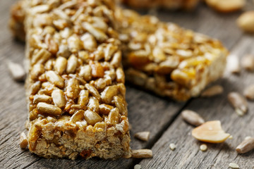 Casinac from sunflower seeds on old vintage background with burlap cloth. Country style. Delicious sweets from seeds of sunflower, sesame and peanuts, covered with shiny glaze