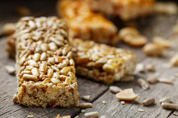 Casinac from sunflower seeds on old vintage background with burlap cloth. Country style. Delicious sweets from seeds of sunflower, sesame and peanuts, covered with shiny glaze