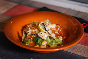Fried fish, teriyaki sauce, vegetable salad