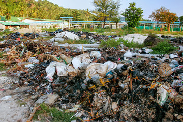 Obraz premium Pile of burned garbage in Ton Sai village on on Phi Phi Don Island, Krabi Province, Thailand