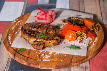 Steak, smoked vegetables, pickled onions