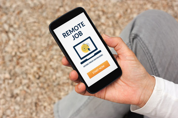 Hand holding smart phone with remote job concept on screen