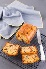 Traditional Italian bread with dried tomatoes and olives. Homemade cakes for lunch and breakfast and ingredients. Free space for text. Copy space.