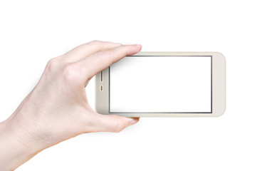 Womans hand holding horizontal the gold telephone with blank screen, isolated on white background.