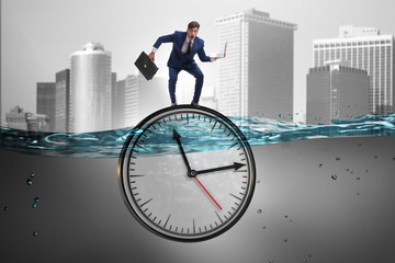 Businessman in deadline and time management concept
