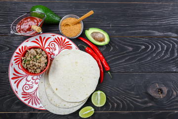 Fototapeta na wymiar cooking for healthy fresh quesadilla, tacos, buritto, fajitas. delicious mexican burito at kitchen. Tasty mexican cuisine