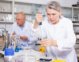Female scientist working with reagents