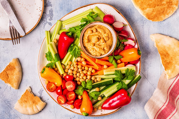 Hummus with various fresh raw vegetables.