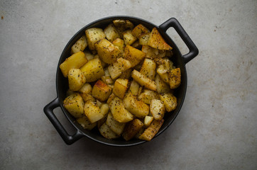 Baked potatoes in a frying pan