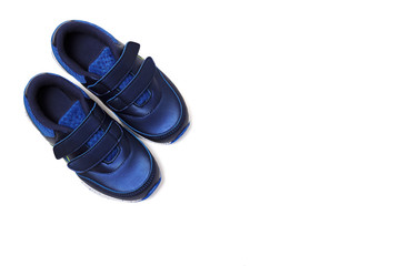 Pair of sports shoes, blue sneakers isolated on white background. Top view.