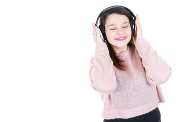 Young beautiful woman enjoying with listening the music in white blank copy space background