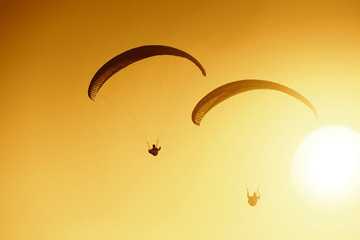 paragliding at beautiful sunset
