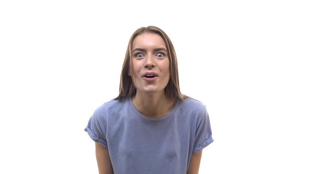 Slowmo impressed astonished gorgeous young blond caucasian woman widen eyes drop jaw bending forward reacting incredible unbelievable luck, smiling saying wow, fantastic surprising achievement