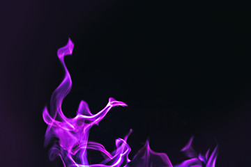 Fototapeta na wymiar Black background image of purple fire forms