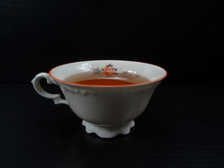 Tea cup porcelein old fashion white with black background