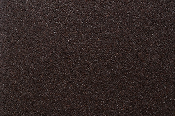 Texture of chocolate brown ceramic surface, macro.