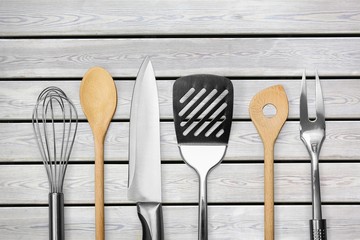 Kitchen metal and wooden utensil on  background