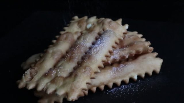 Carnival fritters topped with icing sugar, a typical Italian sweet of Carnival celebrations.