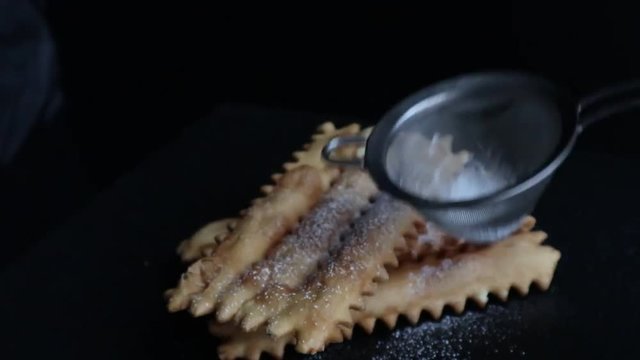 typical italian carnival pasty sprinkled with powdered sugar