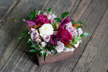 Calla, carnation, Tulip, rose Bush, rose, Ruscus, Pittosporum