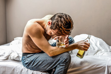 Lonely man is addicted of alcohol. He rolls down in addiction.
