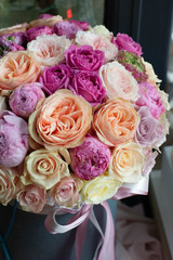 roses, peonies, Ranunculus, buttercups, bouquet in a box