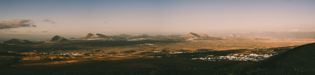 Panoramic of the Island of Lanzarote from the volcano of Teguise during the sunrise