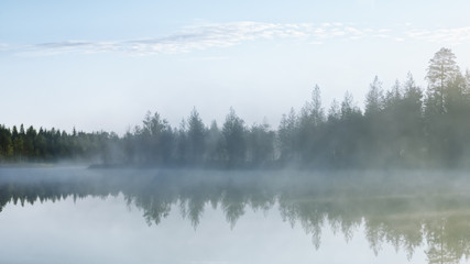 Obraz na płótnie Canvas Foggy Morning On The Northern Forest Lake