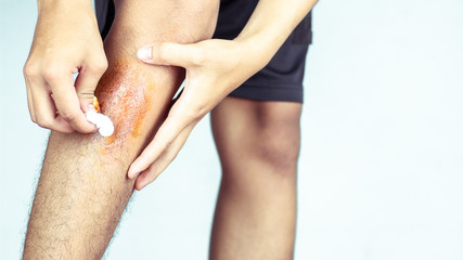 Wound in men's legs, caused by sports.
