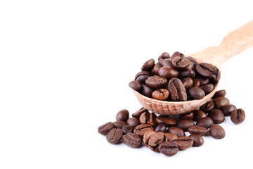 Coffee beans in wooden spoon isolated on white background