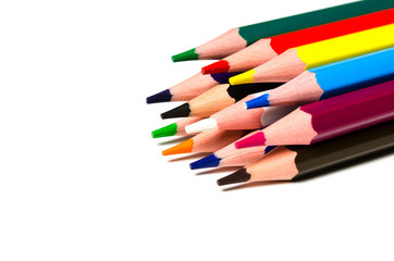 Colourful sharp pencils lie on a white background
