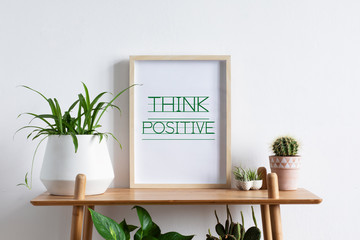 Minimalistic home interior with succulents and picture frame