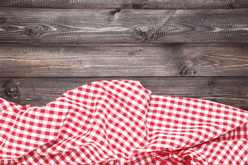 Red napkin on wooden table