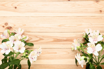 Bouquet of alstroemeria flowers on brown wooden table